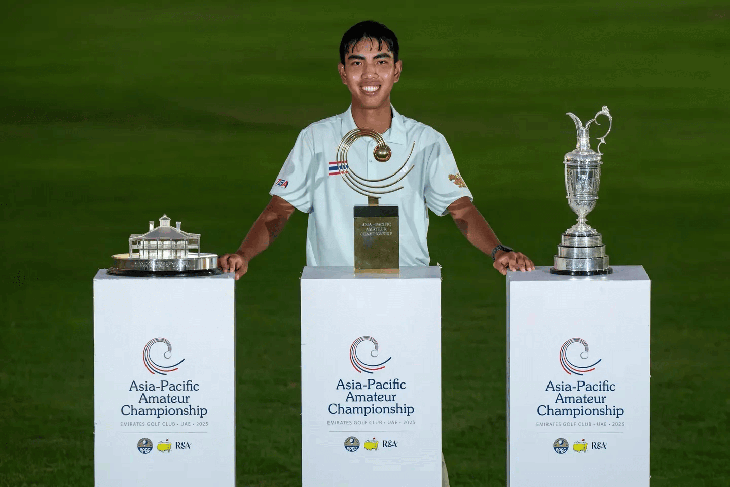 Fifa Laopakdee, the first Thai to win the Asia-Pacific Amateur Championship, stands proudly with the championship trophies at Emirates Golf Club in Dubai.