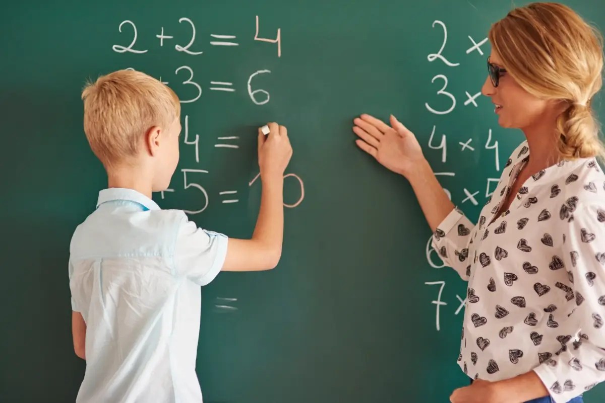 Student developing critical thinking skills while solving a maths problem.