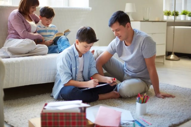 Parents supporting their child's learning at home, reinforcing bullying prevention in schools.