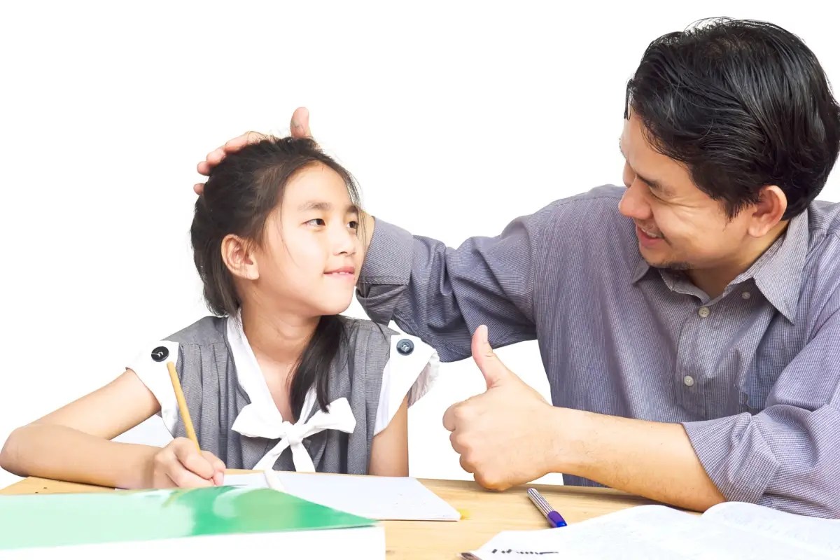 Parents praising effort to support self-esteem in children.