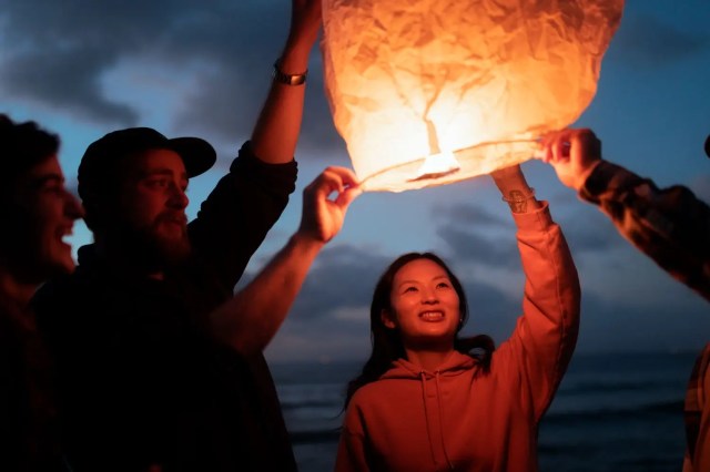 Sky lantern release during Yi Peng, showcasing Thai traditional festivals.