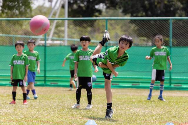 student-focused-while-playing-sport Young student focused while playing sport, developing healthy habits through early school athletics