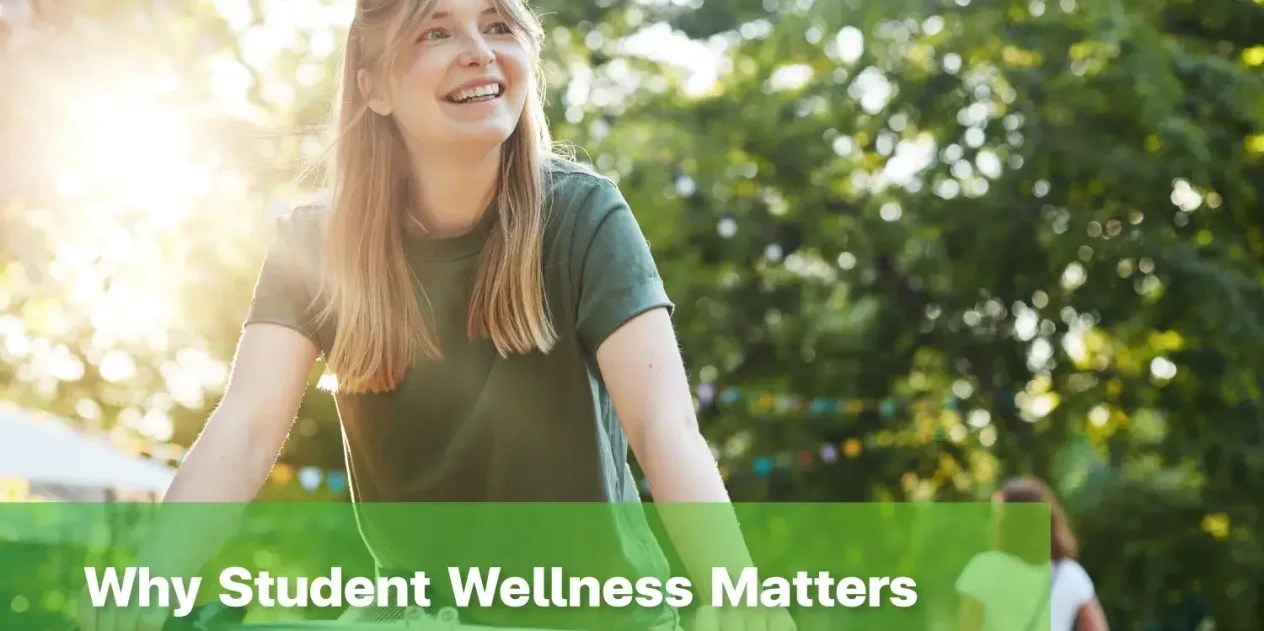 Student wellness in a healthy learning environment with a smiling student riding a bicycle outdoors.