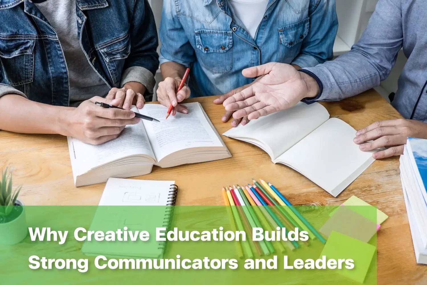 Students collaborating on a classroom project, demonstrating creative education benefits through teamwork and discussion.