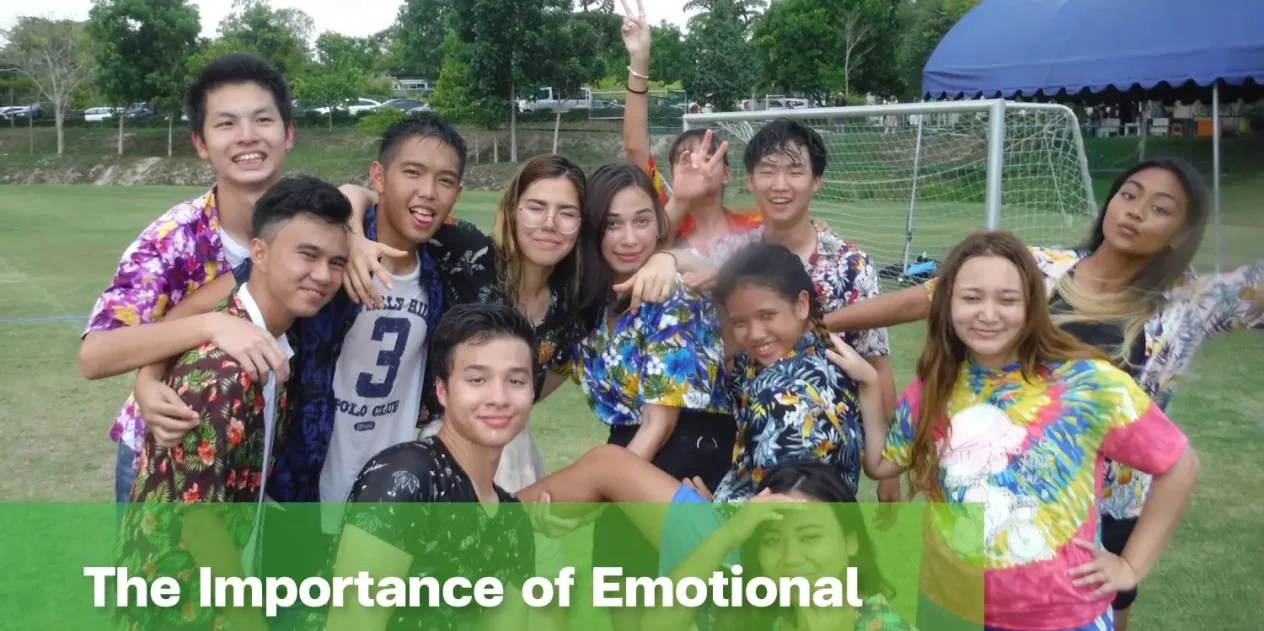 Students sitting together and smiling, reflecting emotional safety at school.