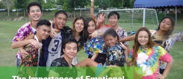 Students sitting together and smiling, reflecting emotional safety at school.