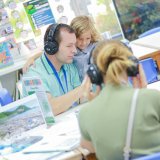 Parent supporting child during early education activity, showing the importance of school–home partnership.