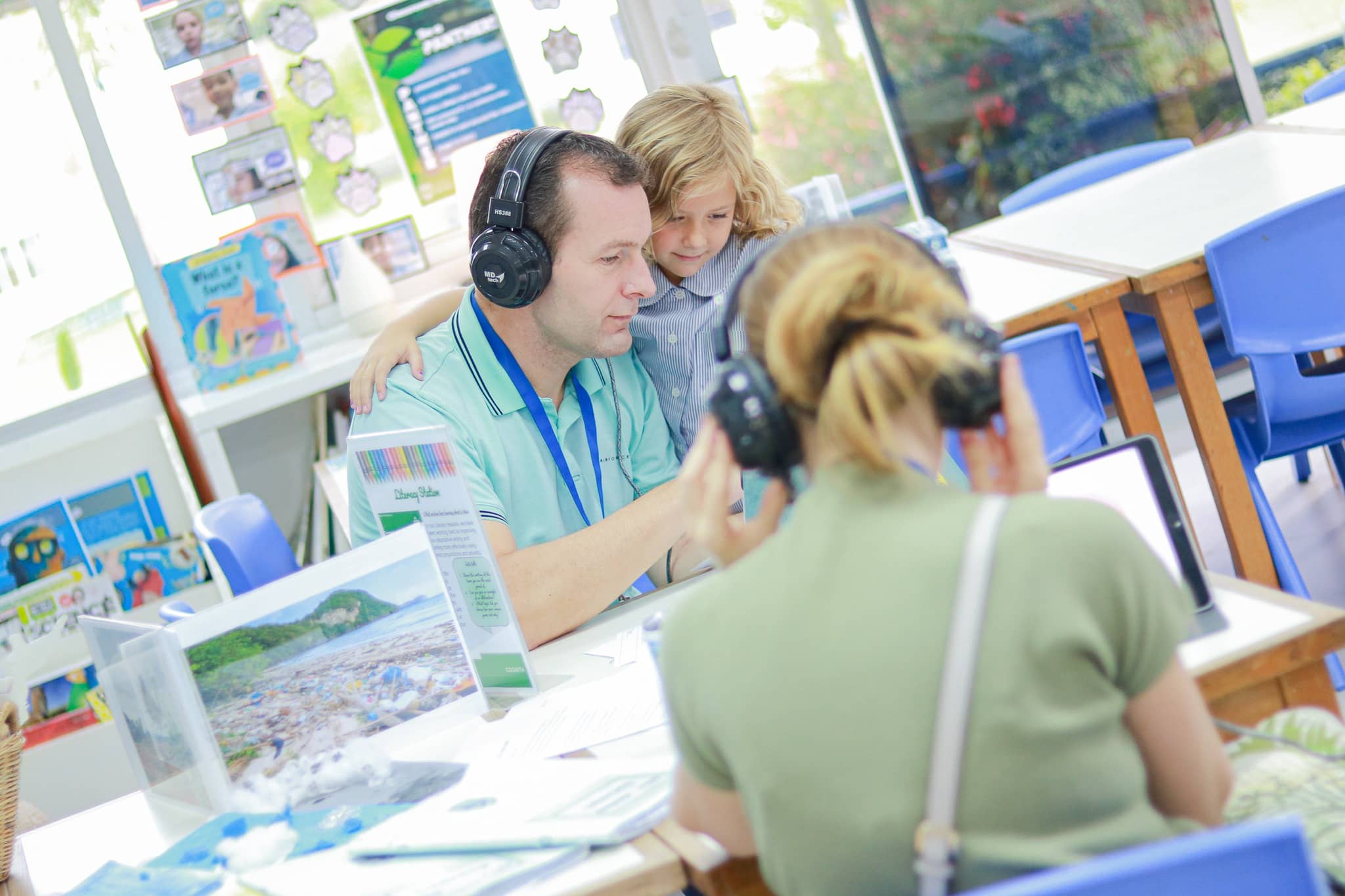 early-education Parent supporting child during early education activity, showing the importance of school–home partnership.