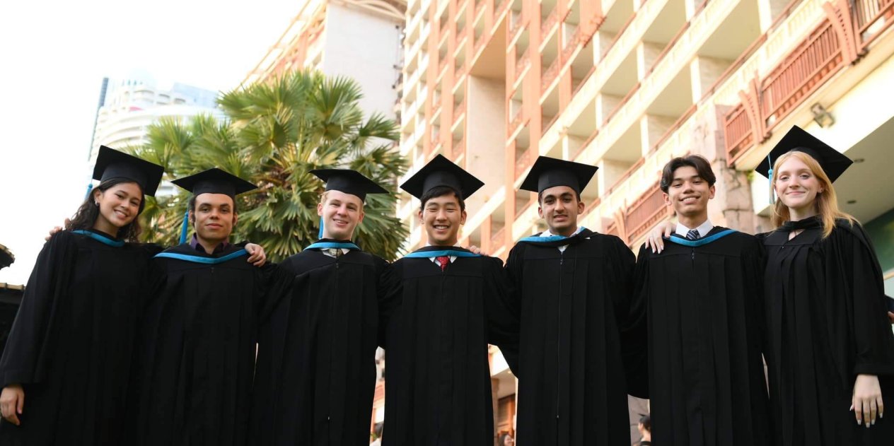 Diverse group of IB graduates from St. Andrews Green Valley stand together in celebration, ready to begin their education and future career journeys