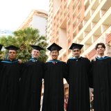 Diverse group of IB graduates from St. Andrews Green Valley stand together in celebration, ready to begin their education and future career journeys
