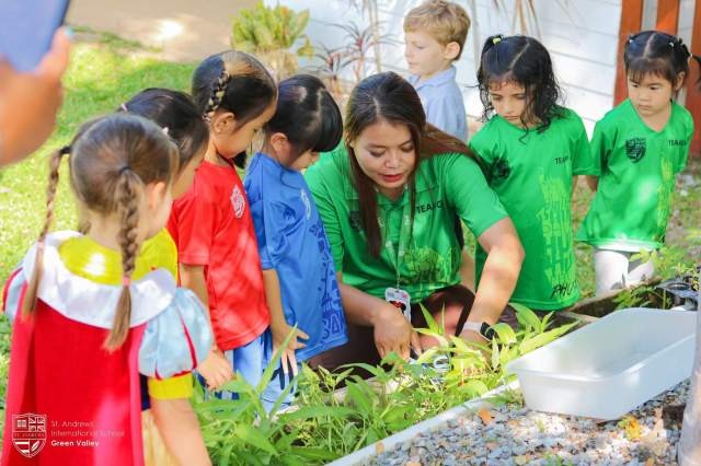 esponsibility-in-eco-school Reception students at St. Andrews Green Valley plant and harvest morning glory as part of hands-on eco-learning, understanding agriculture, sustainability, and real-world responsibility in eco school for early year.