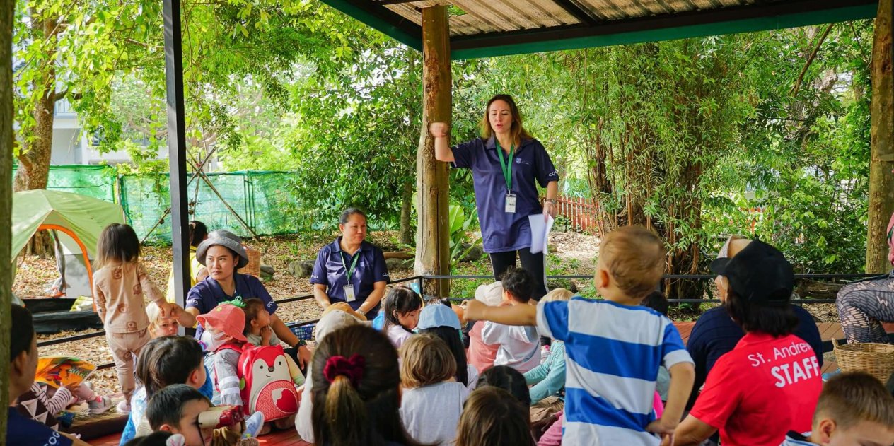 Forest School practitioners lead an outdoor session at St. Andrews Green Valley, supporting young learners through nature-based exploration and personalised guidance.