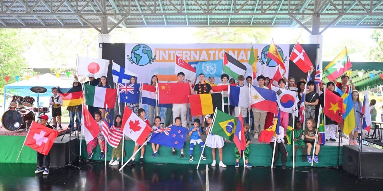 A group of diverse St. Andrews Green Valley students stands together in a powerful display of community.