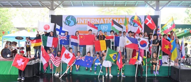 A group of diverse St. Andrews Green Valley students stands together in a powerful display of community.