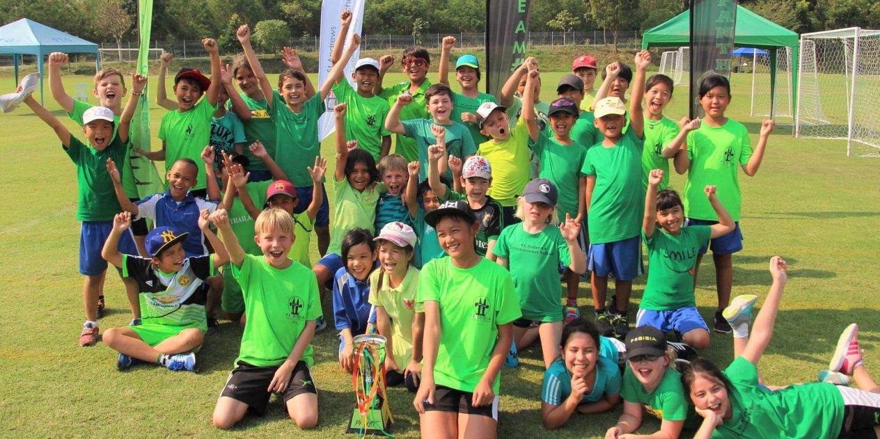 Primary students from St. Andrews Green Valley cheer together in house colours after a school event, celebrating the energy, identity, and inclusive spirit at the heart of the house system.