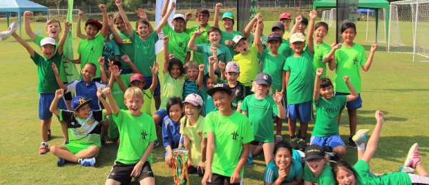 Primary students from St. Andrews Green Valley cheer together in house colours after a school event, celebrating the energy, identity, and inclusive spirit at the heart of the house system.