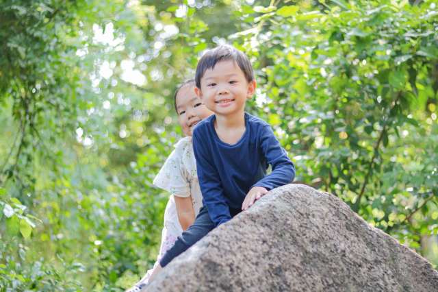 school-for-preschoolers Preschooler at St. Andrews Green Valley climb and explore together in nature, building responsibility, independence, and care for their environment in eco school for preschoolers.