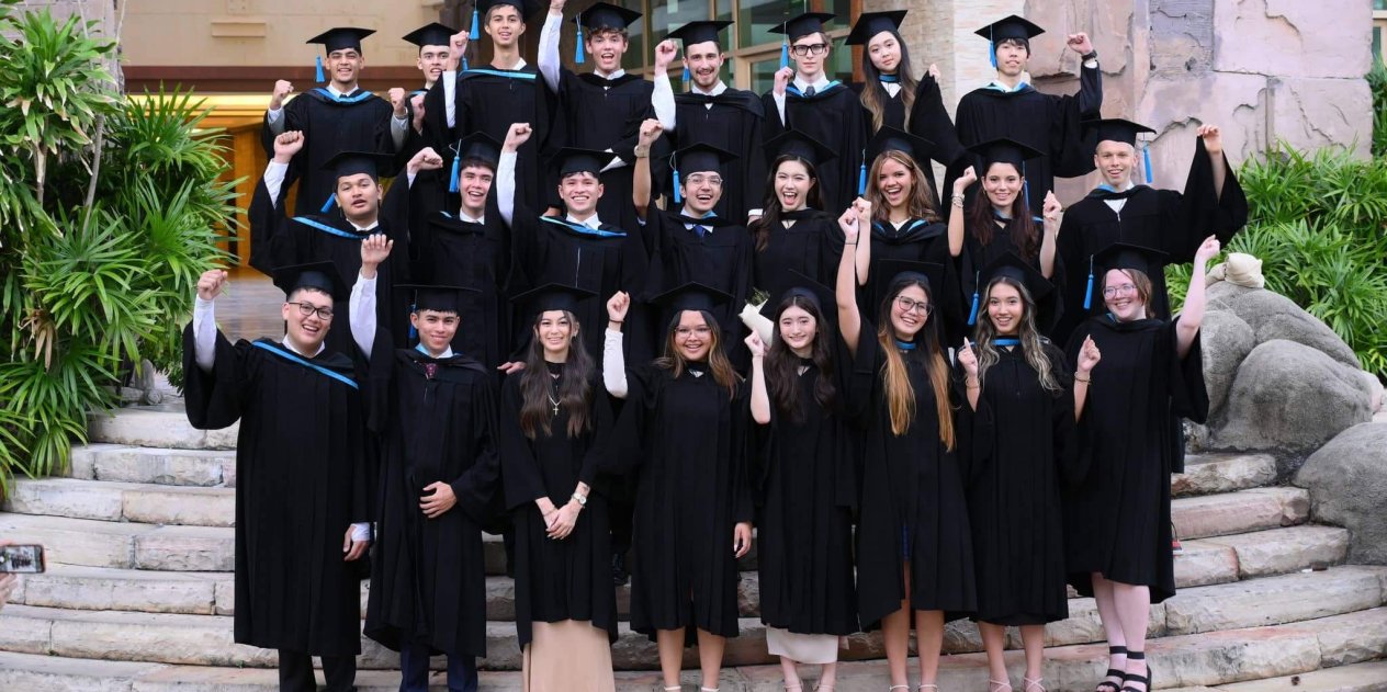 A group of international St. Andrews Green Valley school students celebrate their graduation, ready to take their next step toward university and careers.