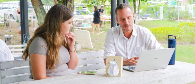 A student consults with a teacher on one-on-one Green Valley's university placement programme.