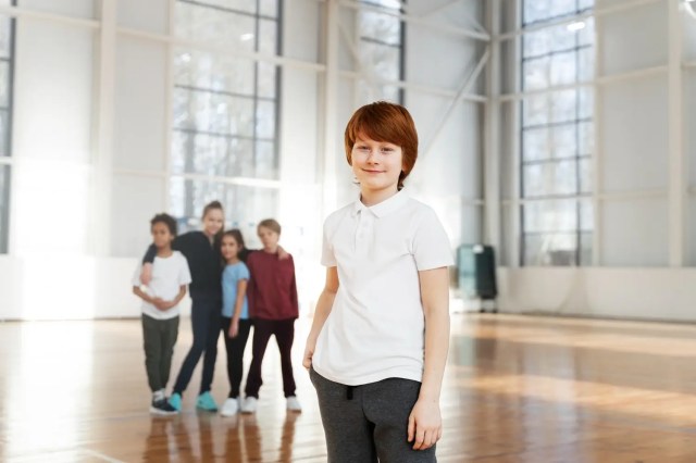 Student building confidence through extracurricular activities in school.