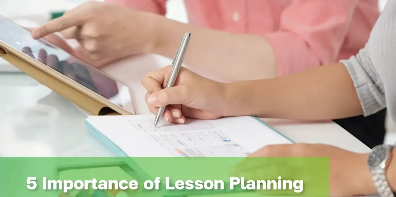 Teacher demonstrating lesson planning for primary school learning activity.