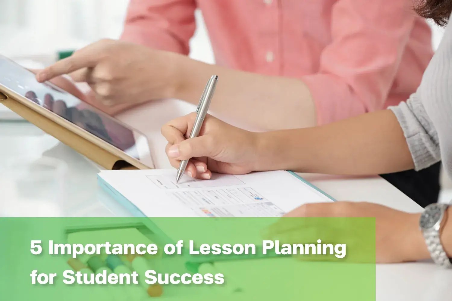 Teacher demonstrating lesson planning for primary school learning activity.