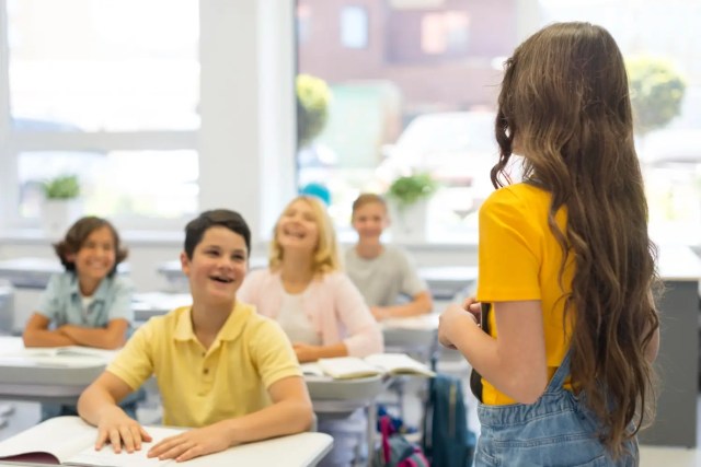 Students engaged in active learning, demonstrating strong student focus in the classroom.